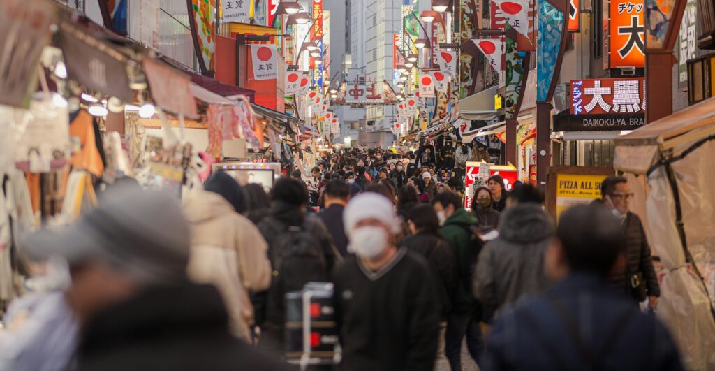 Crowded local street market at night in Tokyo