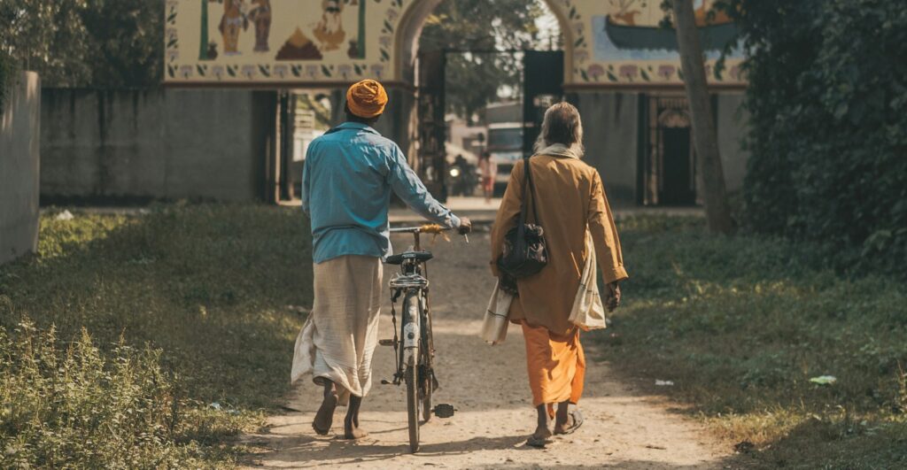 Two friends walking down a street together